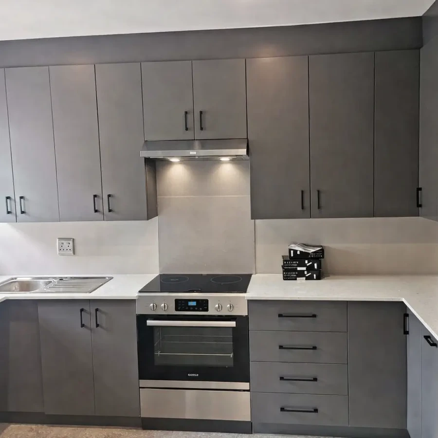 Upgrade your home with a stunning modern kitchen, finished in elegant Storm Grey Melawood and luxurious Dazzle Quartz countertops. by DSK Woodwork